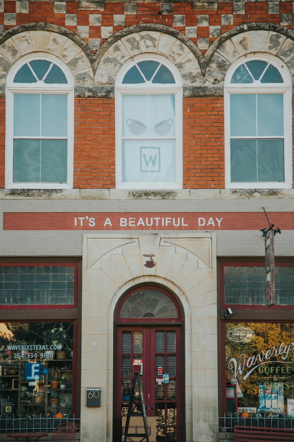 brown and white Its A Beautiful Day building