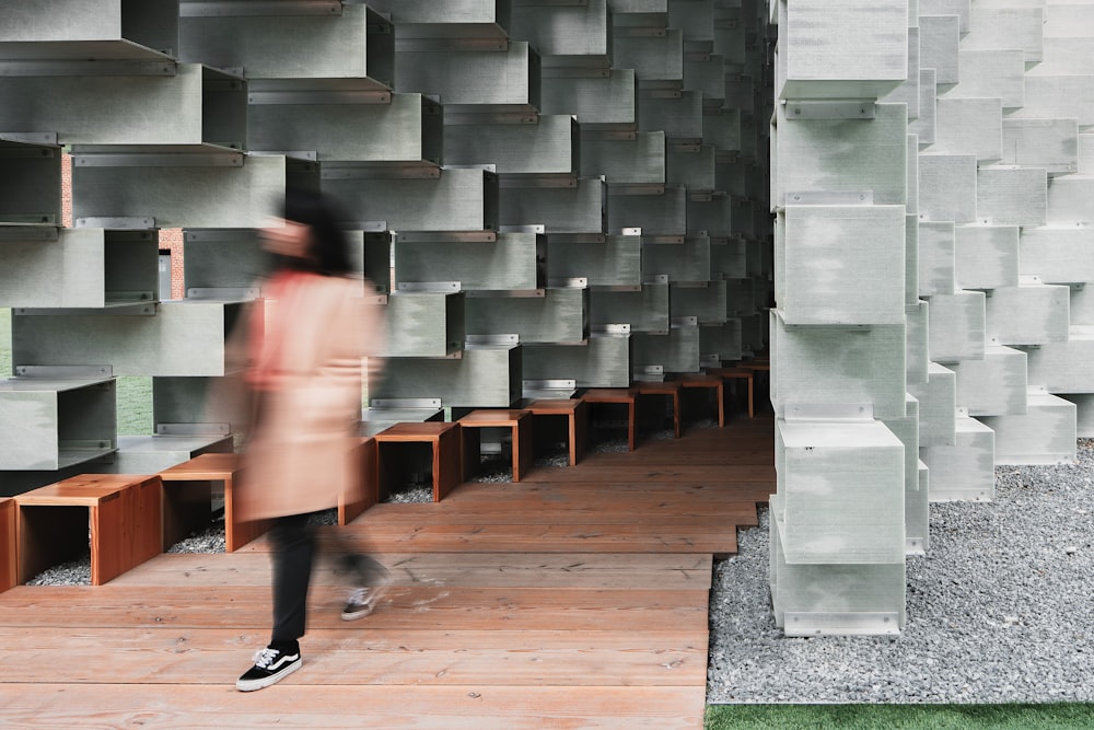 woman walking near wall