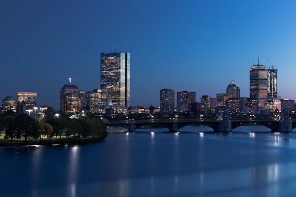 The Boston skyline across the Charles River at blue hour