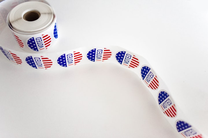 A roll of I Voted stickers in front of a white backgroun