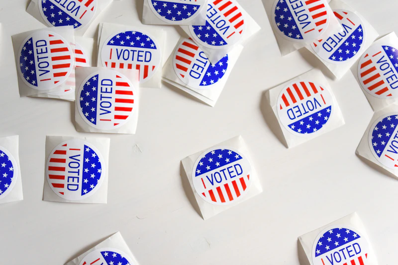 I Voted stickers and ballots on a table