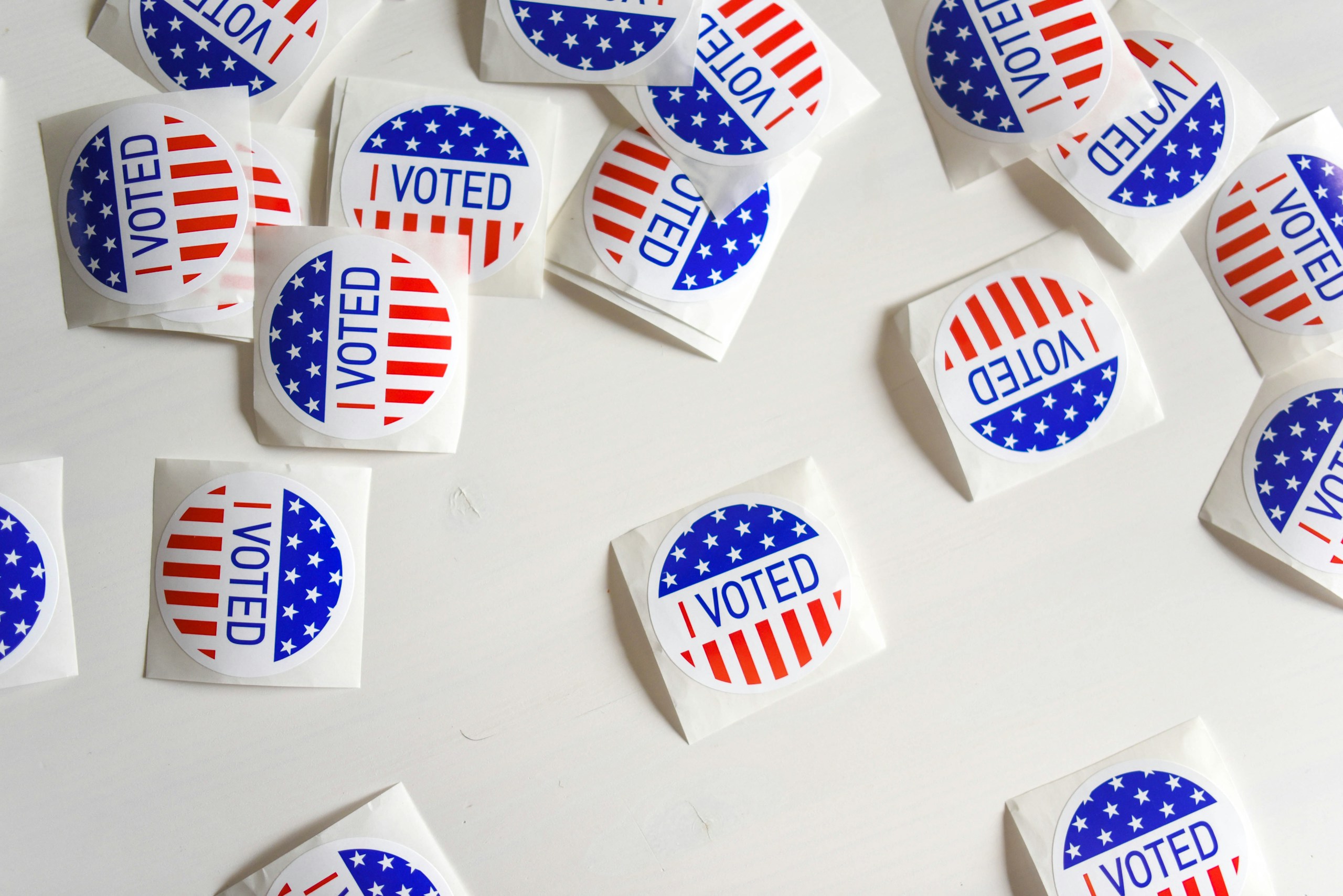 a photo of I Voted stickers on white surface
