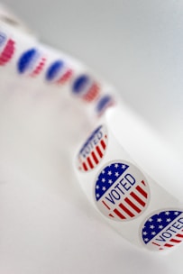 a close up of a toothbrush with the word vote written on it