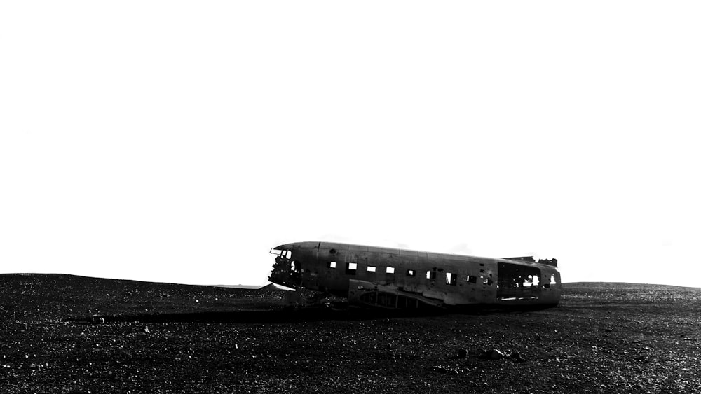 wrecked black submarine on ground