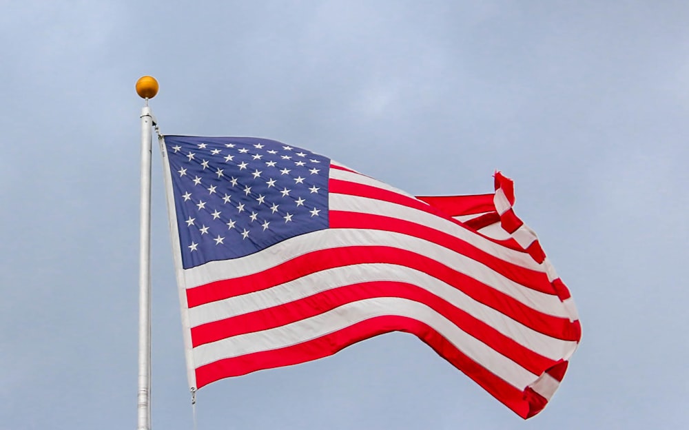 waving US flag on pole
