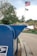 A delivery person placing a package securely in a mailbox.