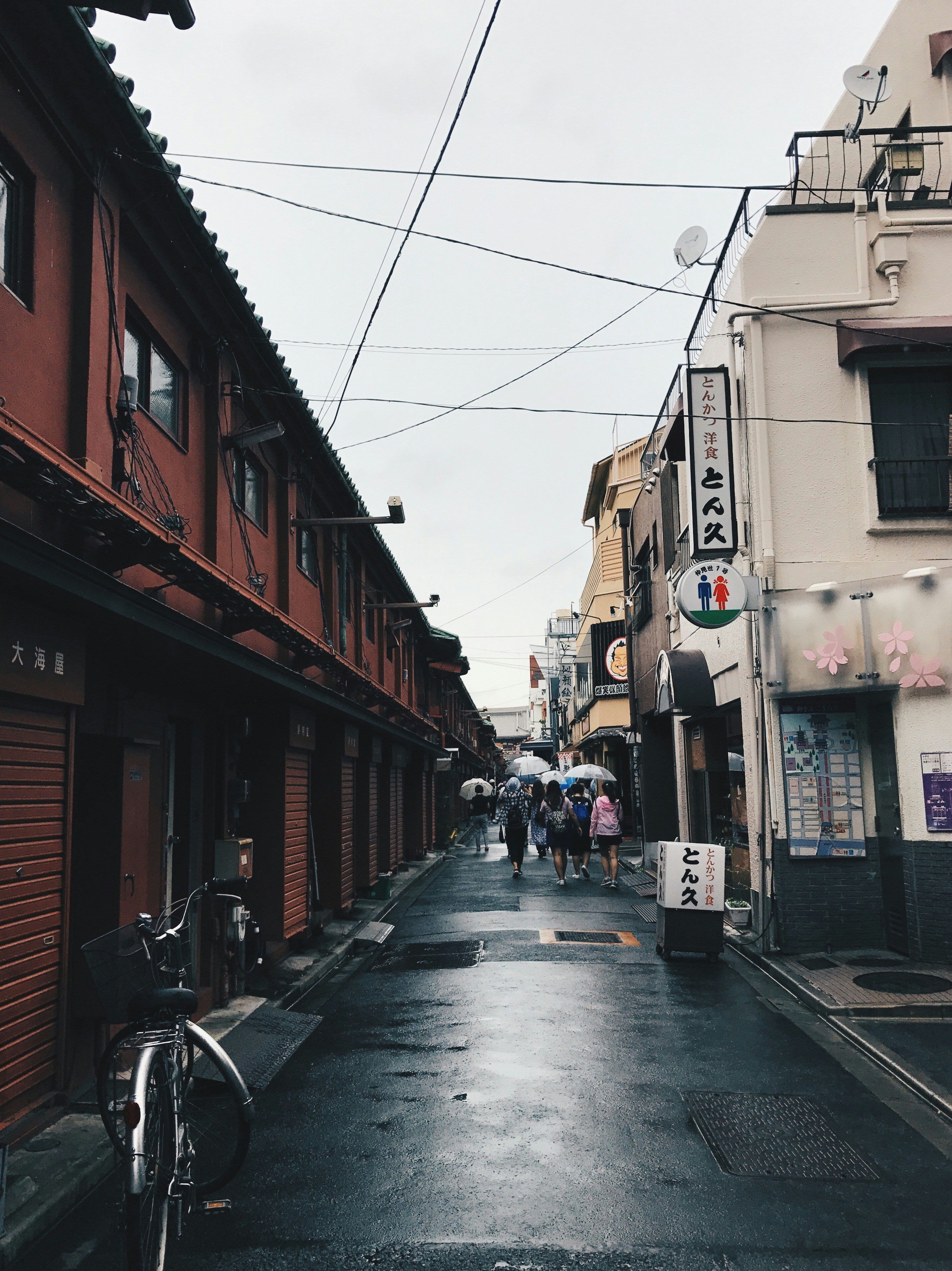 people walking through alley