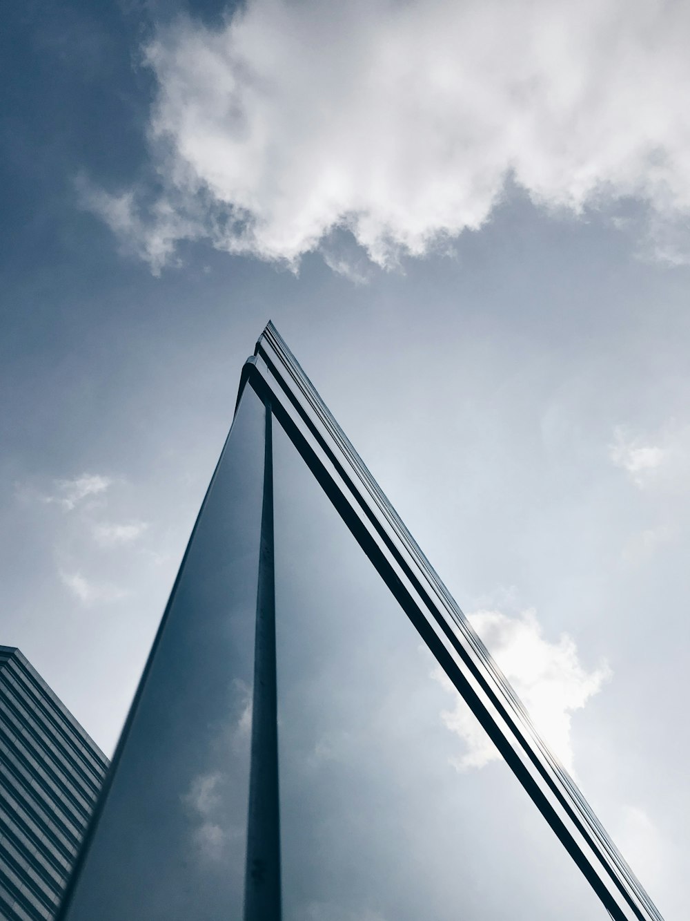 clear glass building under white and blue sky