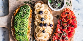 assorted fruits and vegetable on brown wooden chopping board