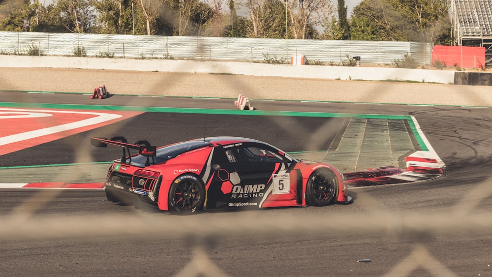 red and black Audi race car on track during daytime