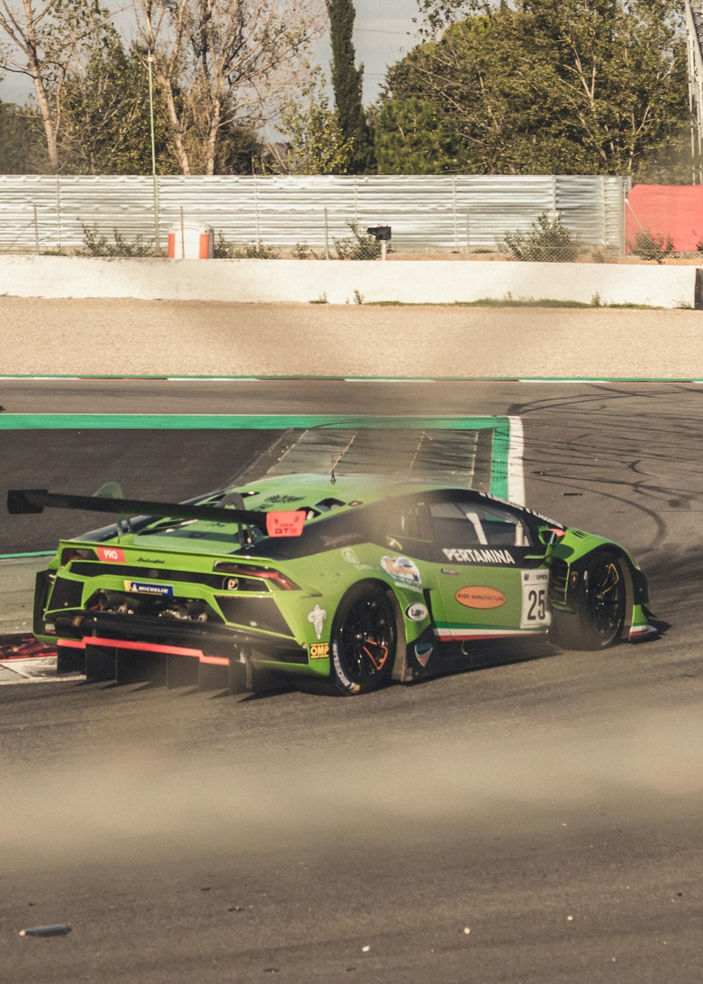 green sports coupe on road