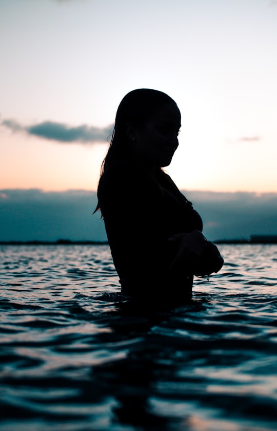 silhouette of woman in body of water in Canary Islands Spain