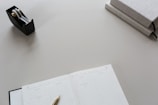 A clean workspace featuring organized books and office supplies.