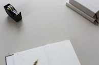 An elegant workspace featuring black and gold decor with a strategic planning notebook open on the desk.