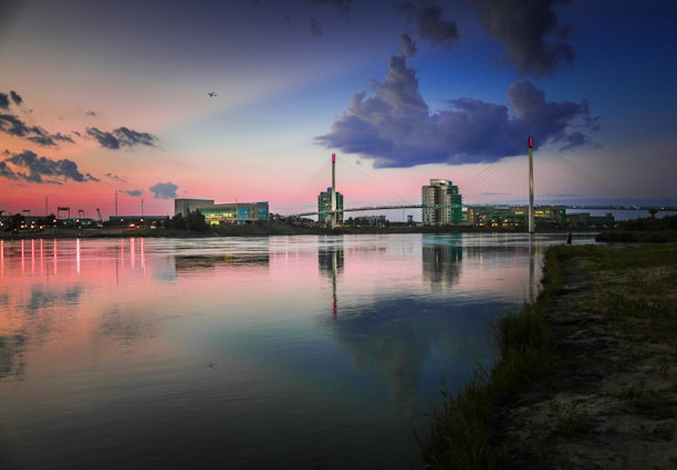 body of water and concrete buildings