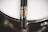 A close-up of a pair of drumsticks resting on a vibrant snare drum.