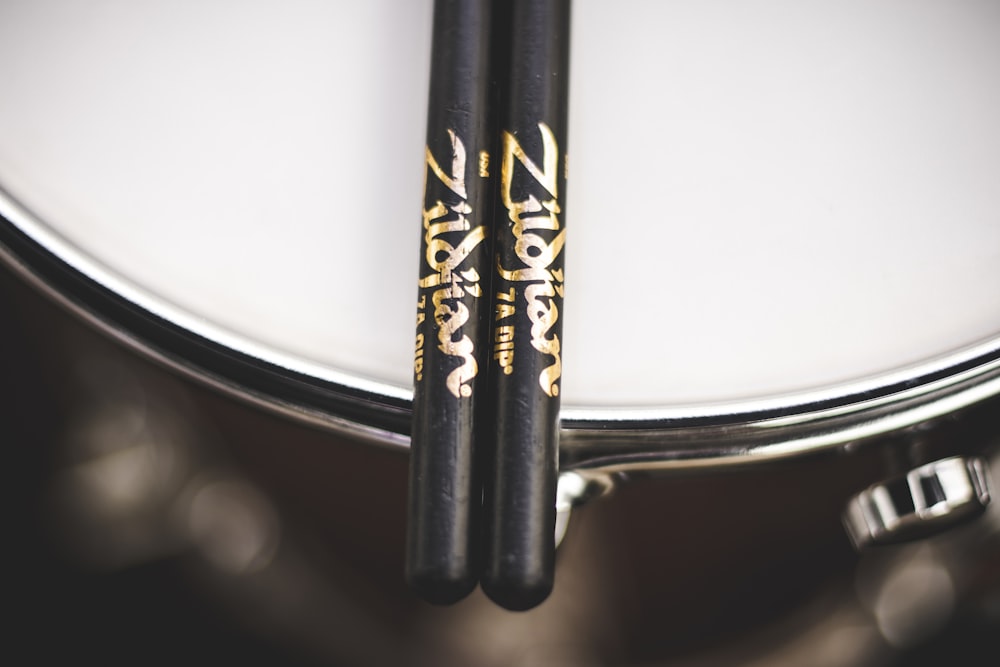 pair of black drum sticks