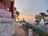Sunrise view from the veranda of Srisailanivas overlooking lush green hills.