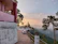 Sunrise view from the veranda of Srisailanivas overlooking lush green hills.