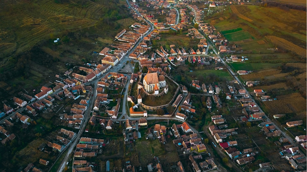 aerial photography of castle surrounded with houses during daytime