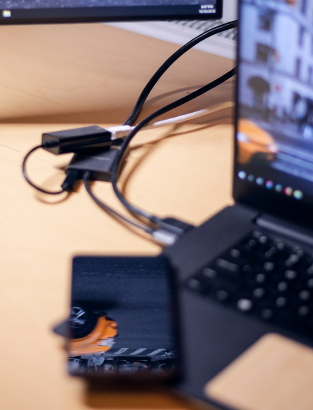 black Android smartphone on the laptop computer