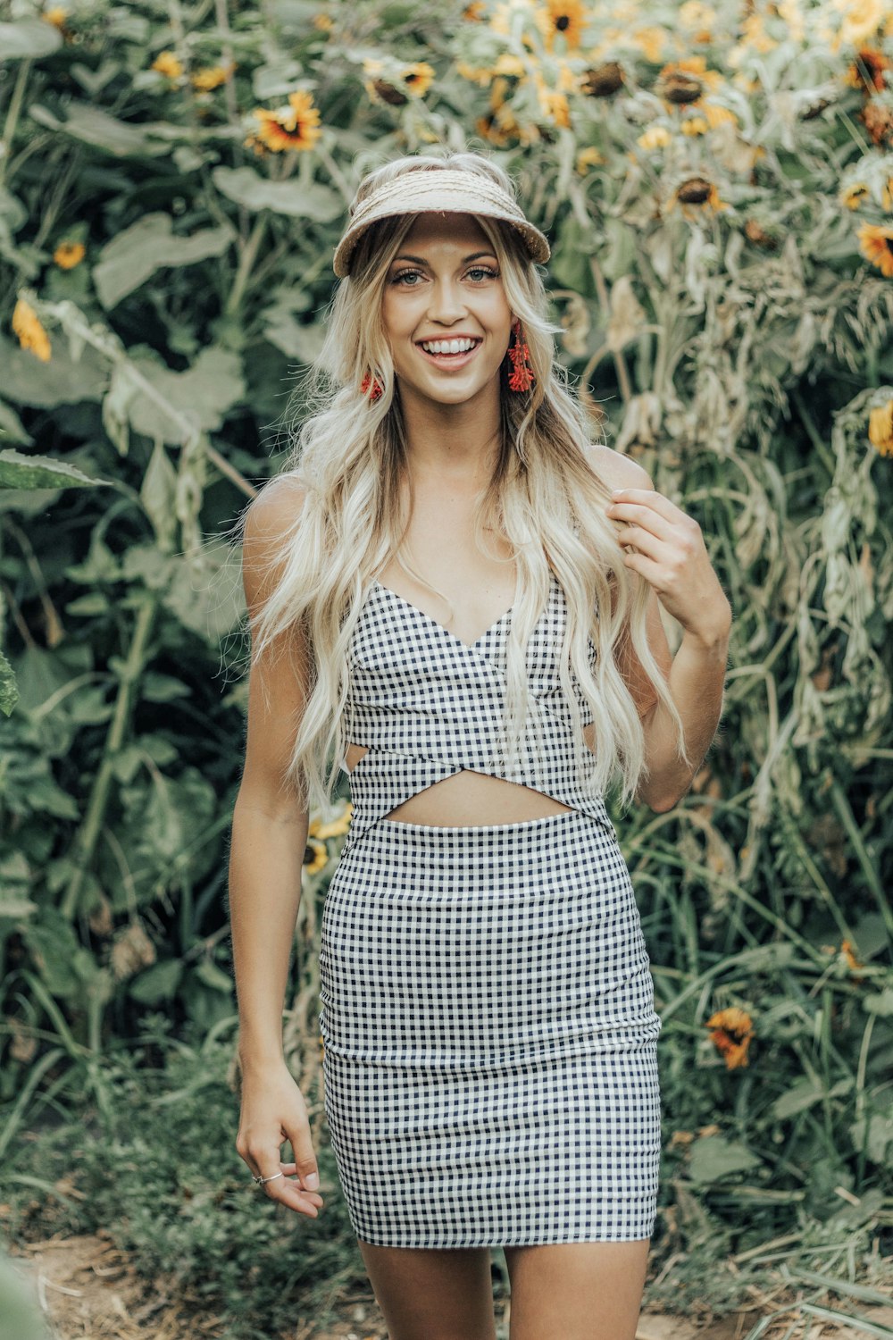 woman standing near sunflower field