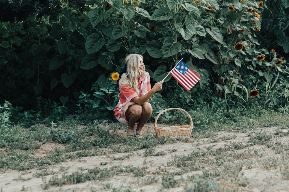 woman holding U.S.A flaglet