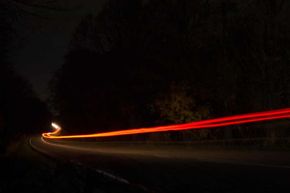 a blurry photo of a street at night