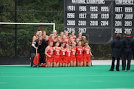 A group of athletes posing together after a competition.