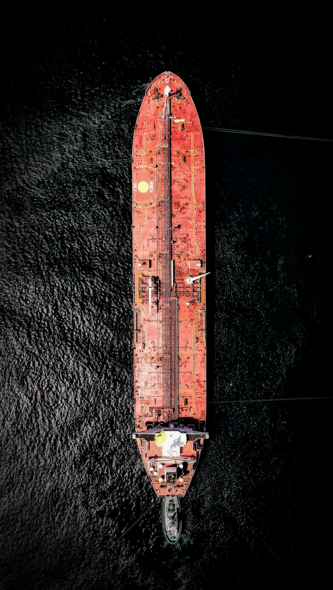 aerial photography of orange cargo ship on sea