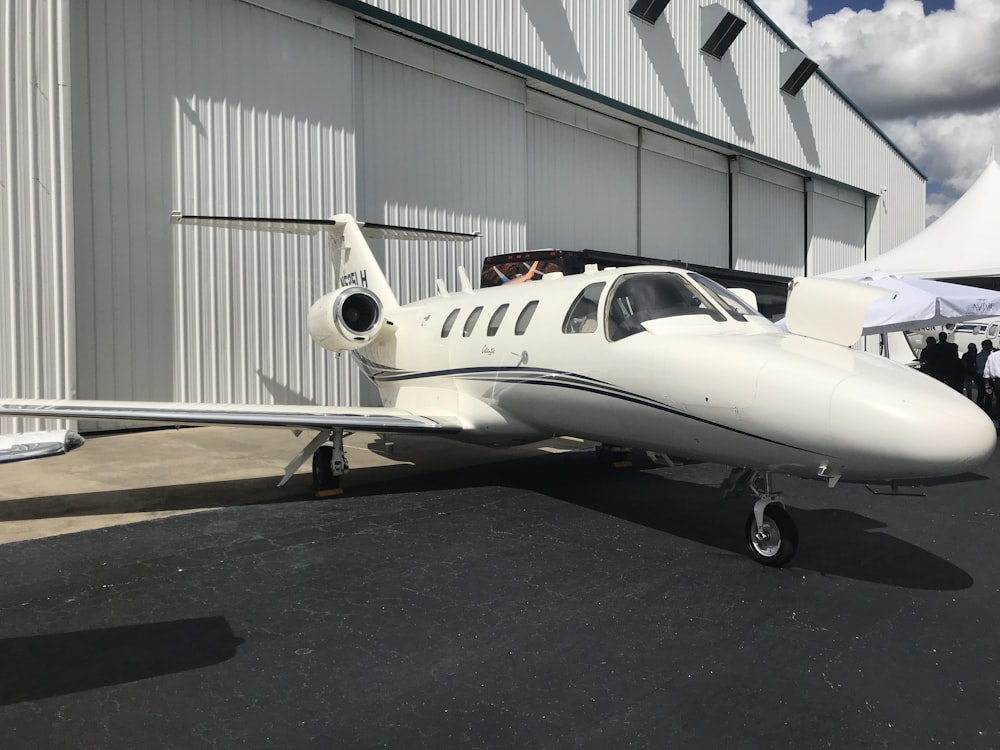 white commercial plane parked