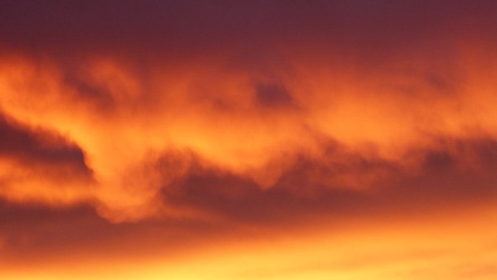 low-angle photo of clouds during golden hour