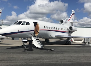 white airliner on gray pavement