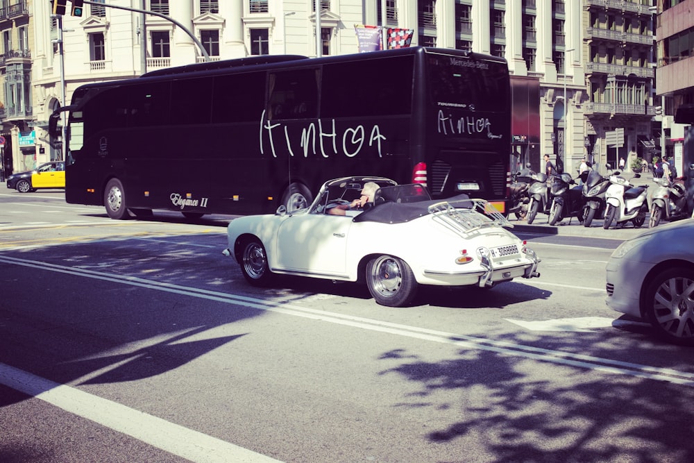 white classic convertible car on road