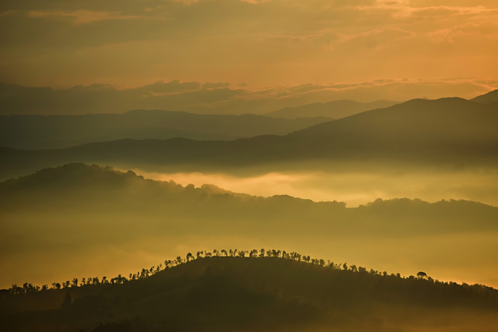 mountain silhouette during cloudy sky