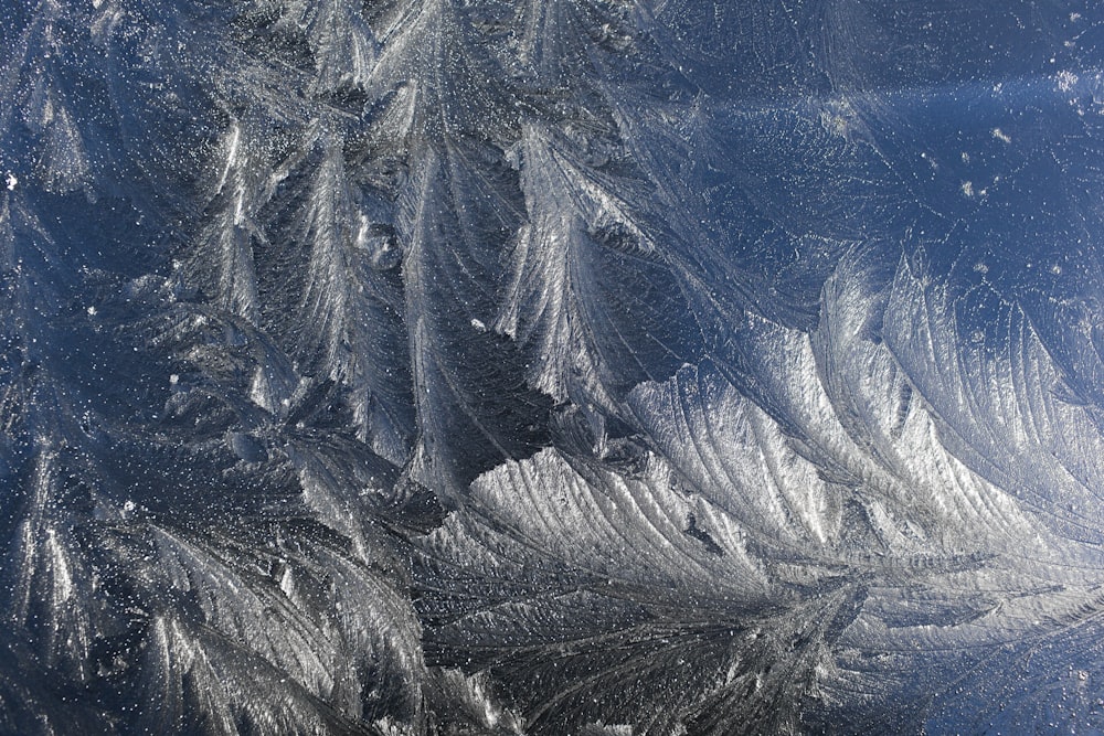 a close up view of a frosty window