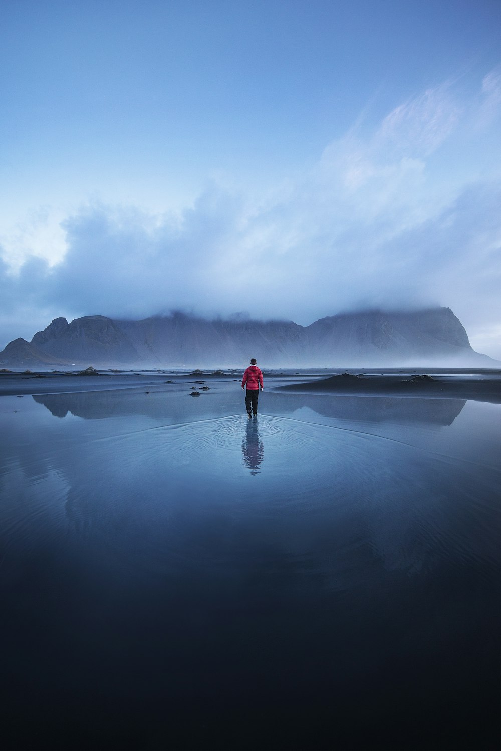 men standing on the ocean during faytime