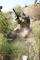 Sentinel Group International personnel performing coordinated training exercises in a rugged terrain.