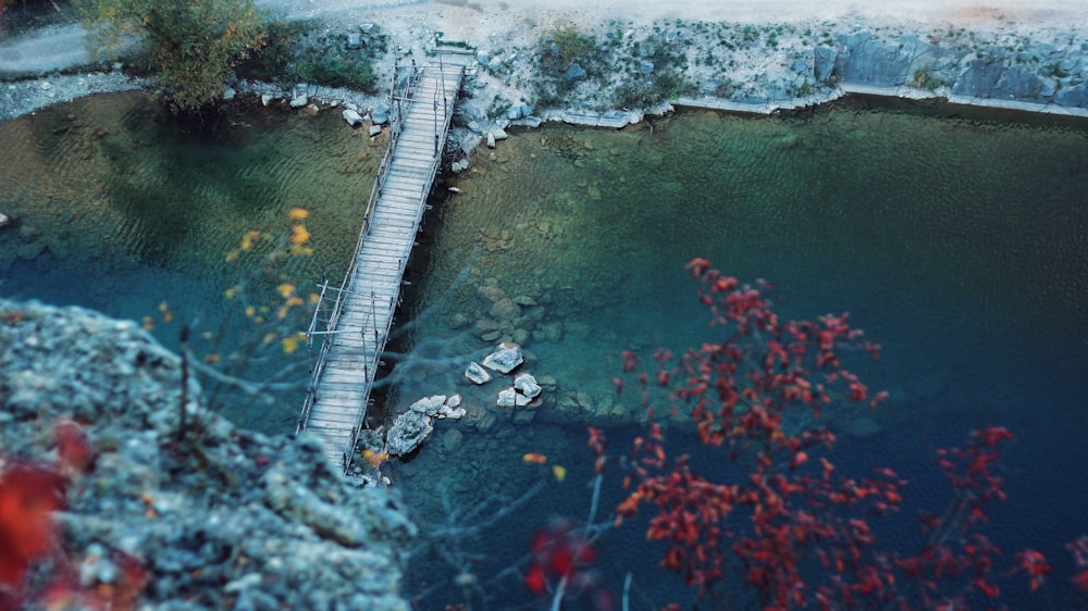 aerial view of brown wooden bridge