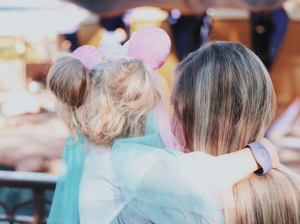 woman carrying a girl