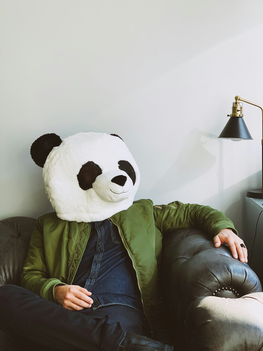 person wearing panda costume head