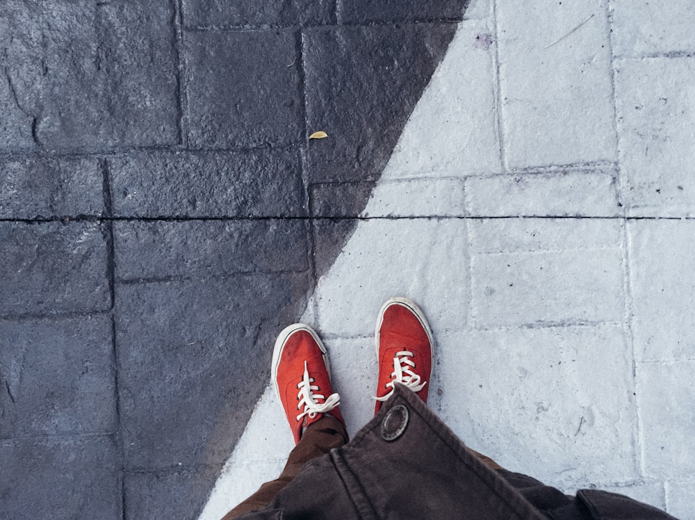 person standing on grey concrete floor