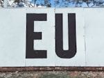 white and back EU painted wall during daytime