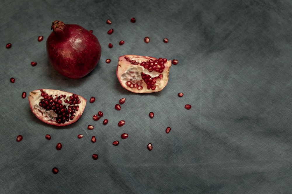 pomegranate fruits on gray textile