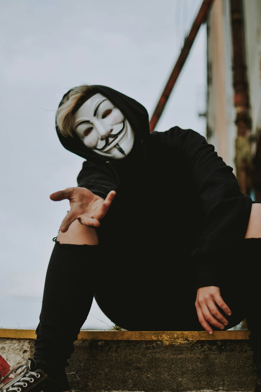 person wearing Guy Fawkes mask