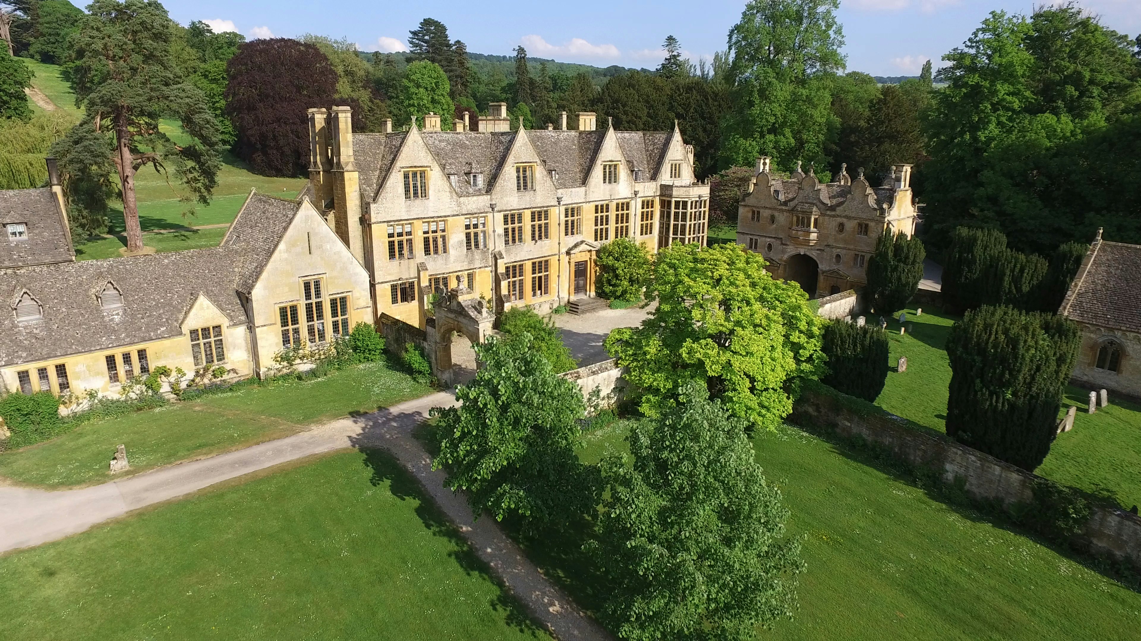 beige painted house and grass field