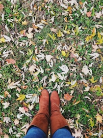person standing on grass field