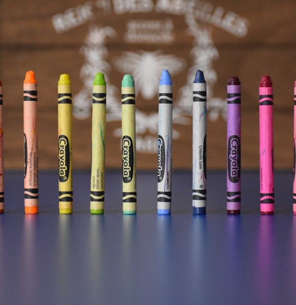 selective focus photography of Crayola crayons