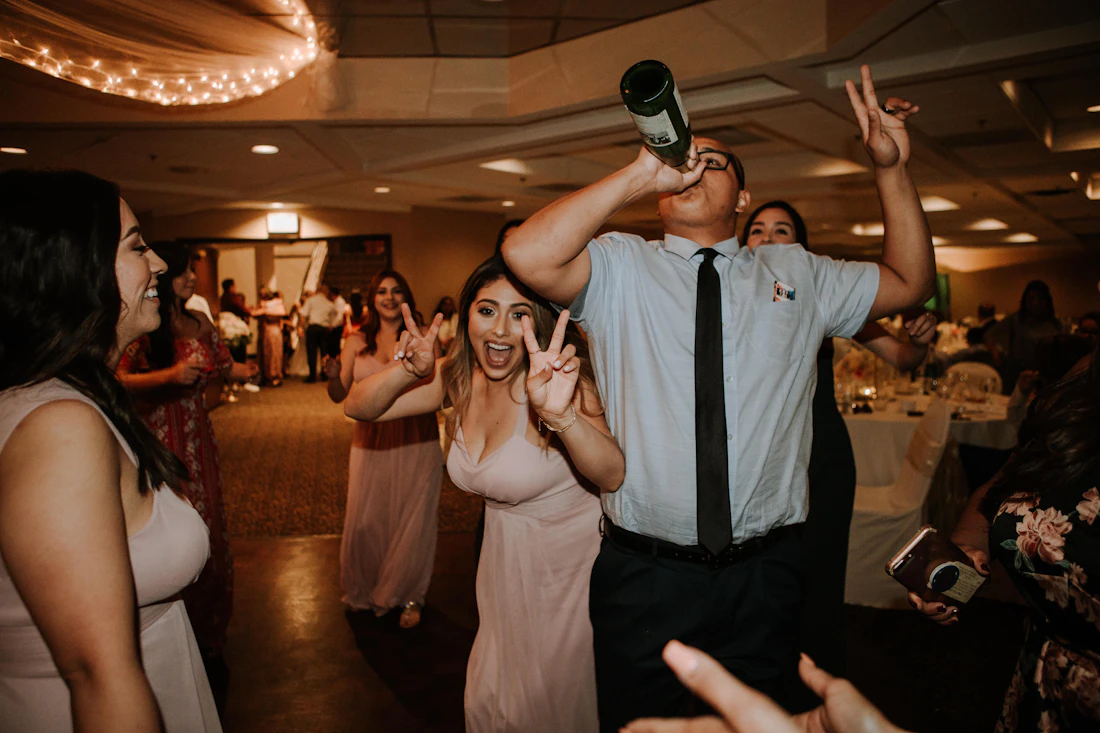 Guests dancing at a crowded indoor party