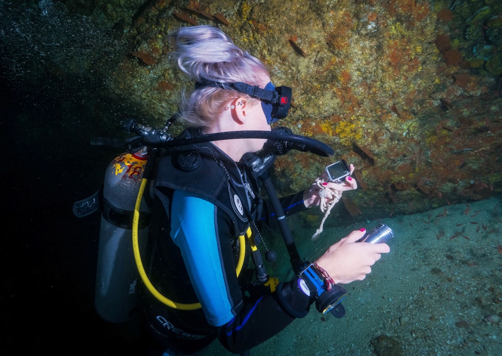 woman diving on body of water